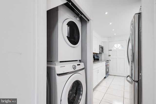 laundry room featuring stacked washer and dryer