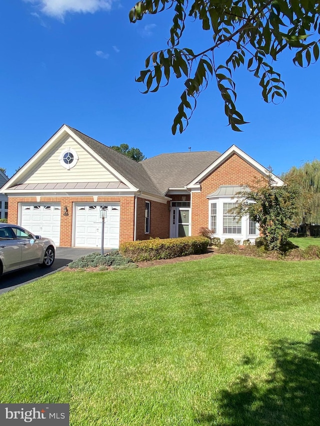 ranch-style home featuring a garage and a front lawn