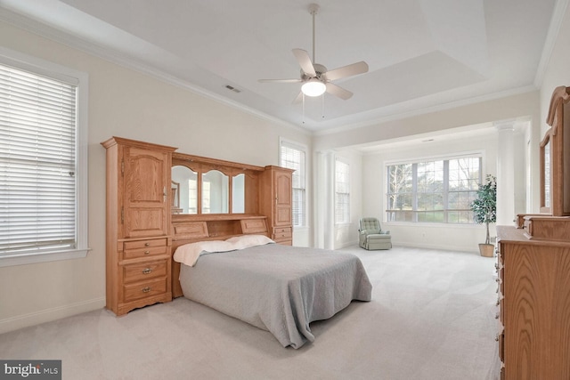 bedroom featuring light colored carpet, ceiling fan, ornamental molding, and decorative columns