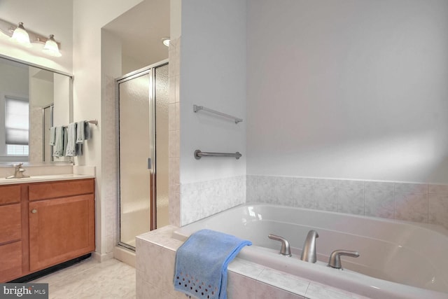 bathroom featuring vanity and shower with separate bathtub