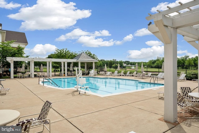 view of pool with a pergola and a patio