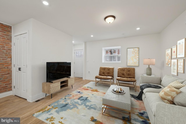 living room featuring light hardwood / wood-style flooring and plenty of natural light