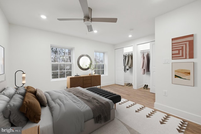 bedroom featuring light hardwood / wood-style floors and ceiling fan