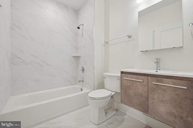 full bathroom with toilet, vanity, and tiled shower / bath