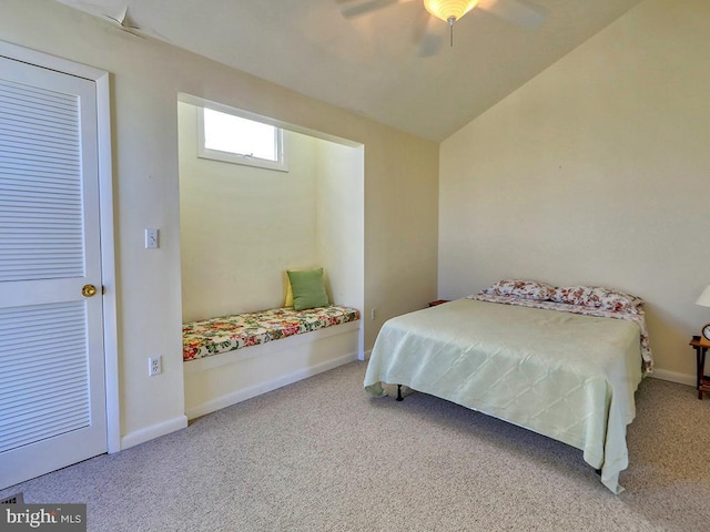 carpeted bedroom featuring a ceiling fan, vaulted ceiling, and baseboards