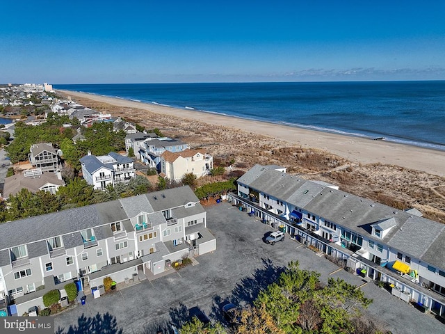 aerial view featuring a view of the beach and a water view