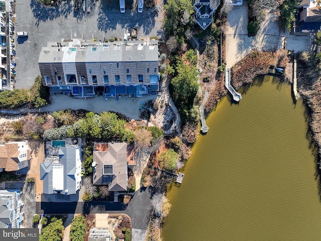 birds eye view of property with a residential view and a water view