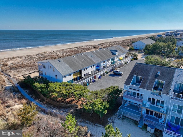 birds eye view of property featuring a view of the beach and a water view