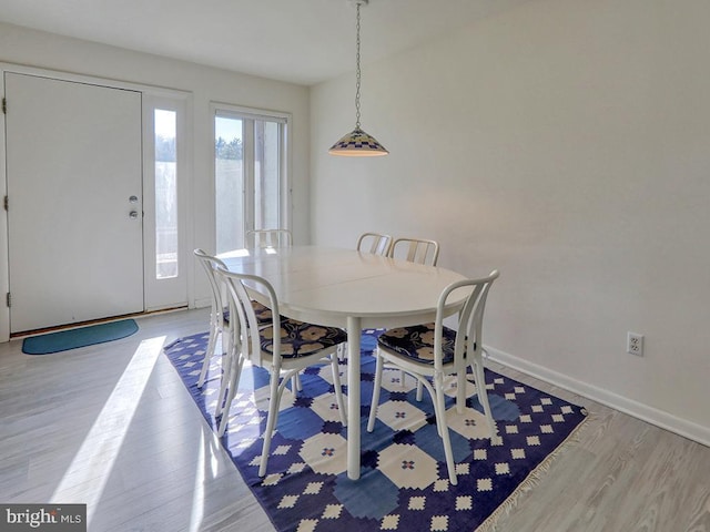 dining space featuring light wood-type flooring