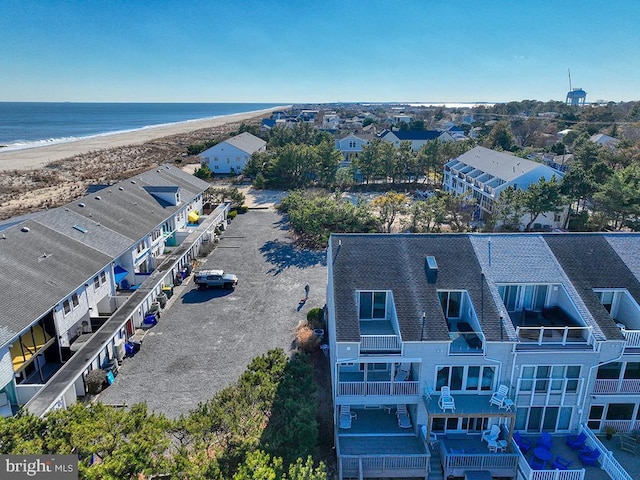 bird's eye view featuring a water view, a residential view, and a view of the beach