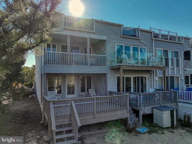 back of house featuring a wooden deck