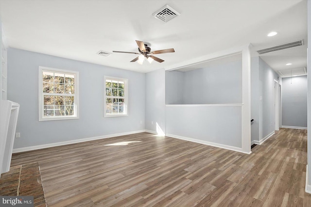 unfurnished room featuring hardwood / wood-style flooring and ceiling fan