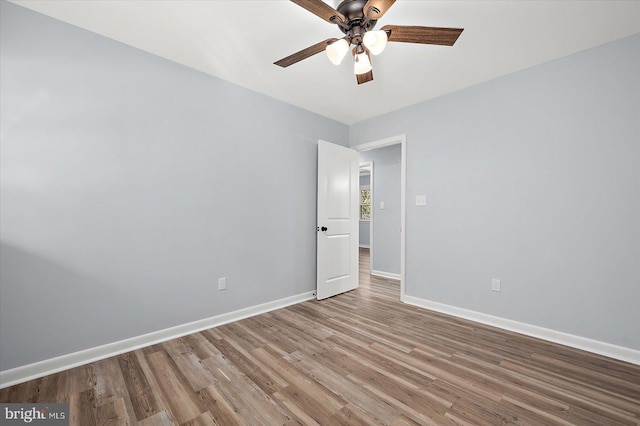 spare room featuring ceiling fan and light hardwood / wood-style flooring