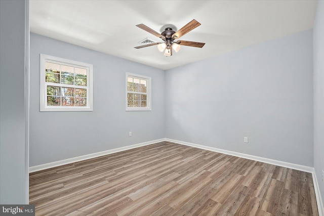 unfurnished room featuring light hardwood / wood-style floors and ceiling fan