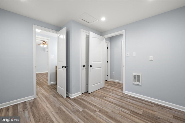 interior space featuring light hardwood / wood-style flooring and ceiling fan