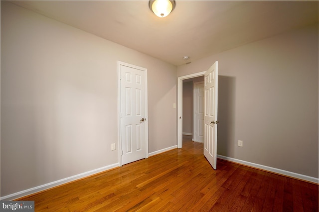 unfurnished room featuring hardwood / wood-style floors