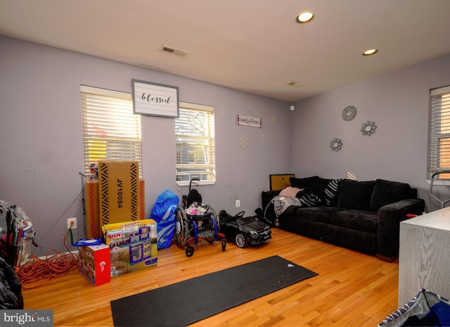 exercise room with wood-type flooring