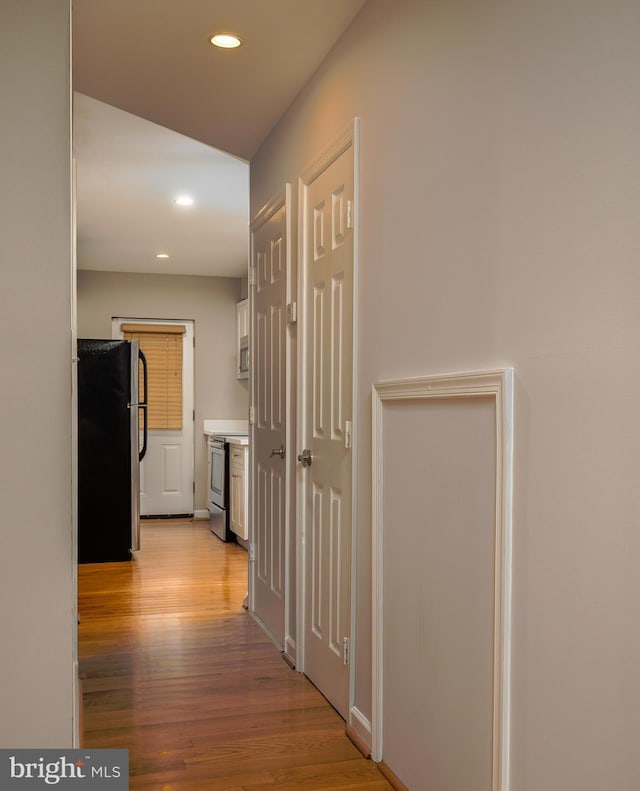 hall featuring light wood-type flooring