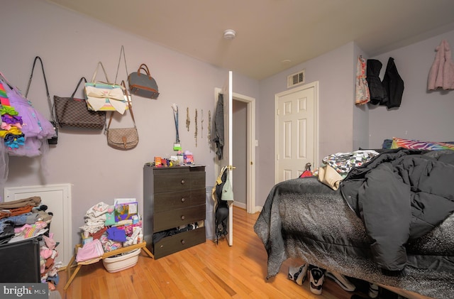 bedroom with hardwood / wood-style floors