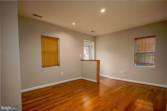 spare room featuring hardwood / wood-style flooring