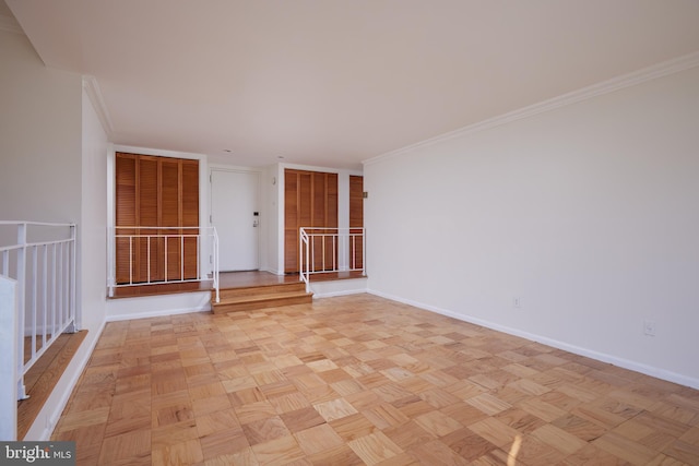 unfurnished room with light parquet floors and crown molding