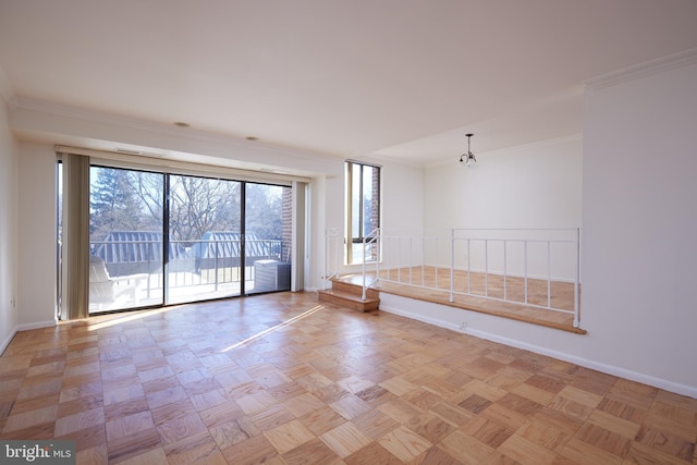 unfurnished room featuring light parquet flooring and ornamental molding