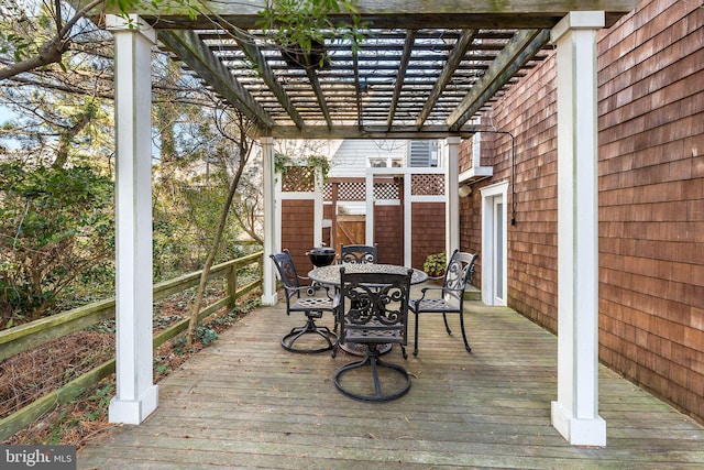 wooden deck featuring a pergola