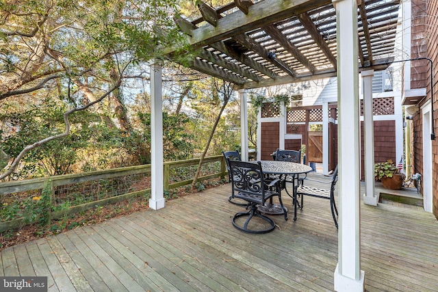 wooden terrace with a pergola