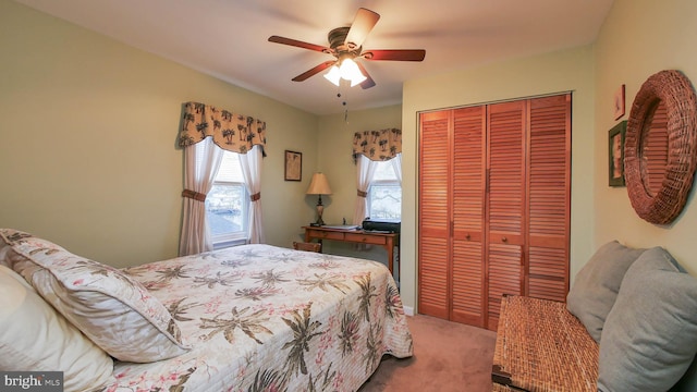 bedroom with carpet floors, a closet, and ceiling fan