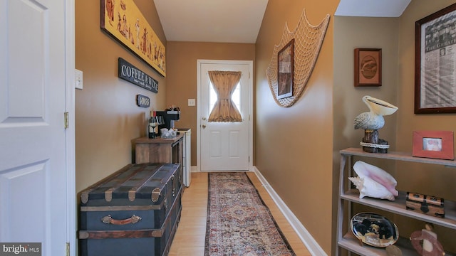 doorway to outside featuring light wood-type flooring