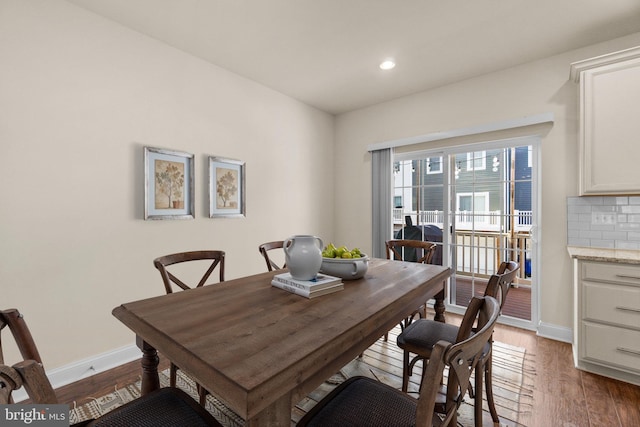 dining space featuring dark wood-type flooring