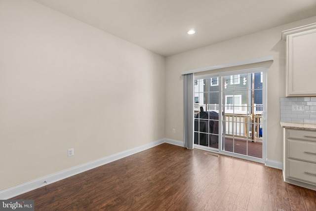 unfurnished dining area with hardwood / wood-style flooring