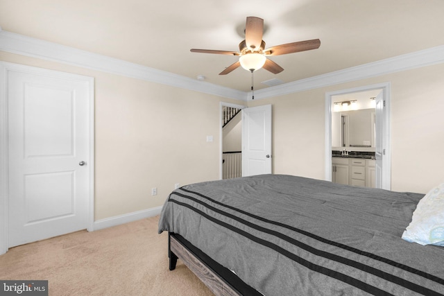 carpeted bedroom featuring ensuite bath, ceiling fan, ornamental molding, and sink