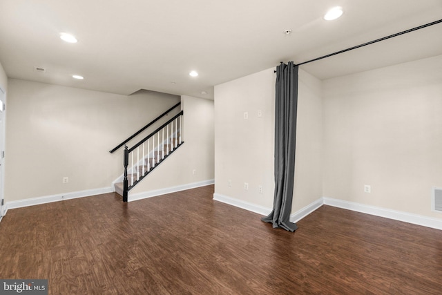 basement with dark wood-type flooring