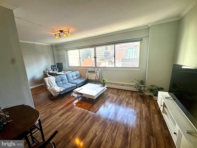 living room with a wall mounted air conditioner, dark hardwood / wood-style flooring, and ornamental molding