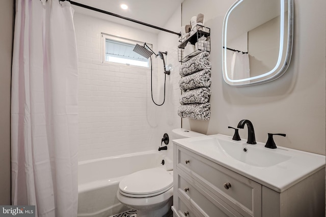 full bathroom with vanity, toilet, and shower / tub combo with curtain