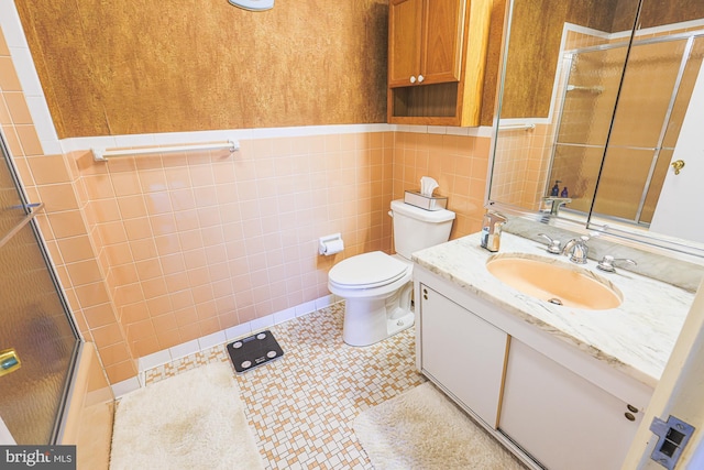 bathroom with tile patterned flooring, toilet, tile walls, and walk in shower