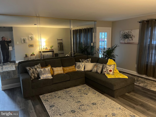 living room with dark wood-type flooring