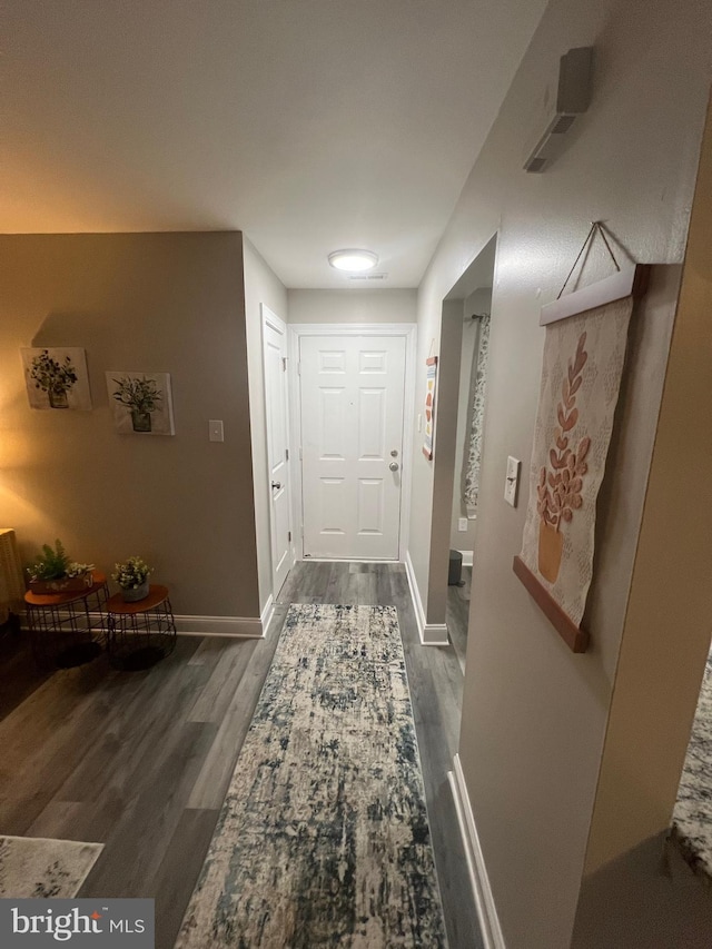 corridor featuring dark wood-type flooring