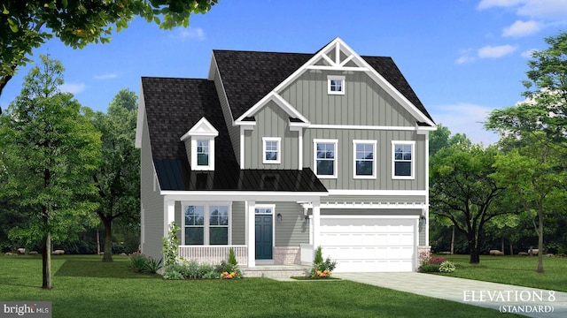 view of front of home with a front lawn and a garage