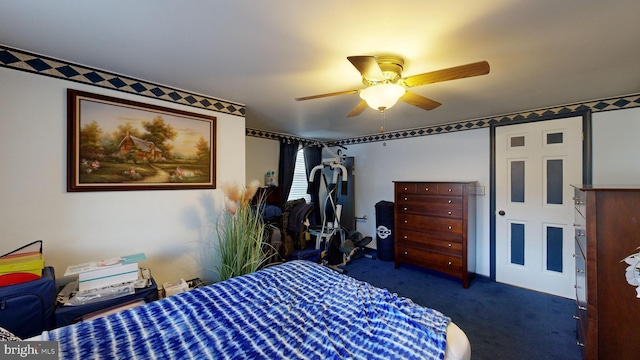 bedroom featuring ceiling fan and dark carpet