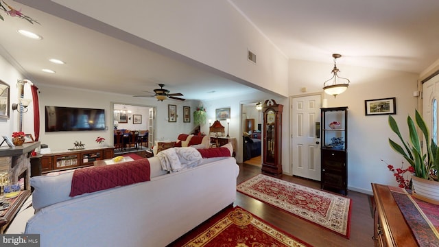 living room featuring dark hardwood / wood-style flooring and ceiling fan