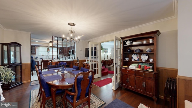 dining room with french doors, dark hardwood / wood-style flooring, and ornamental molding