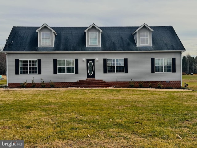 new england style home with a front lawn