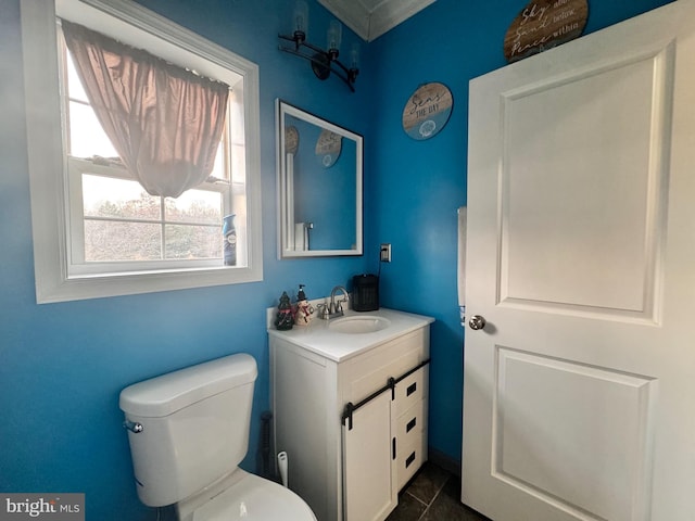 bathroom featuring tile patterned floors, vanity, and toilet