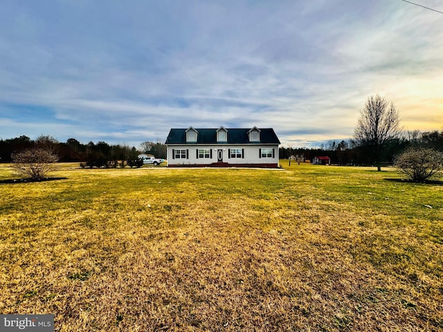 view of front of house with a yard