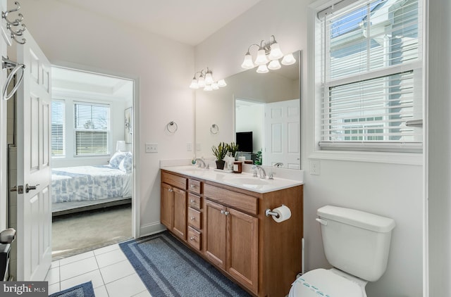 bathroom featuring tile patterned flooring, vanity, and toilet