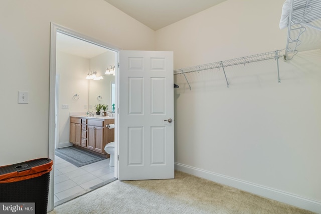 bathroom featuring tile patterned floors, vanity, and toilet