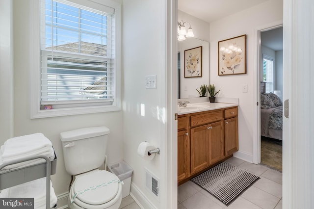 bathroom featuring tile patterned floors, plenty of natural light, and vanity