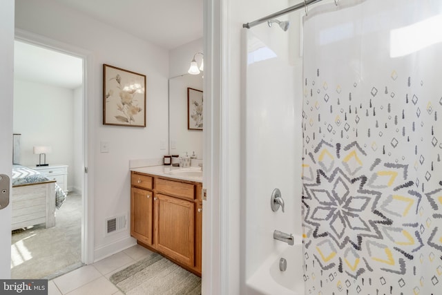 bathroom with shower / washtub combination, vanity, and tile patterned flooring